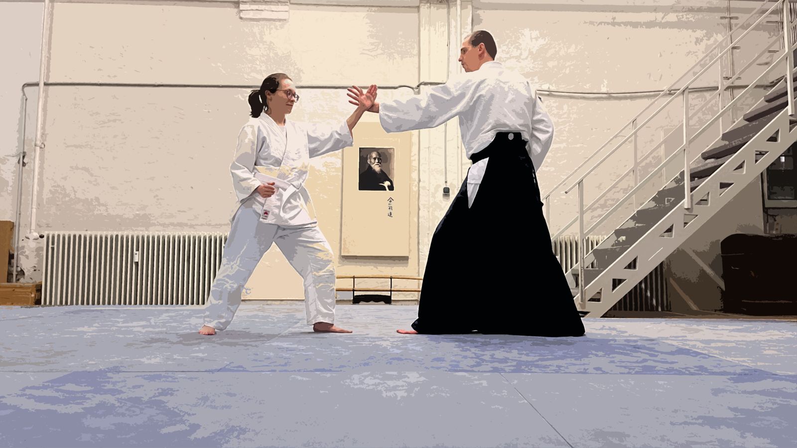 Zwei Aikidoka in Ausgangshaltung auf der Matte des Daimon-Dojo